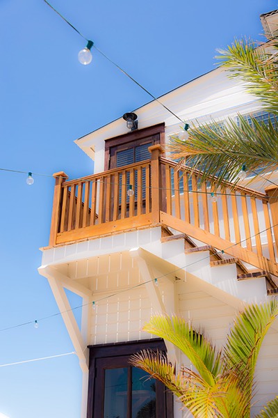 mahogany steps leading up to the tiny apartment above the Rum & Bean at Mahogany Bay Village in Belize