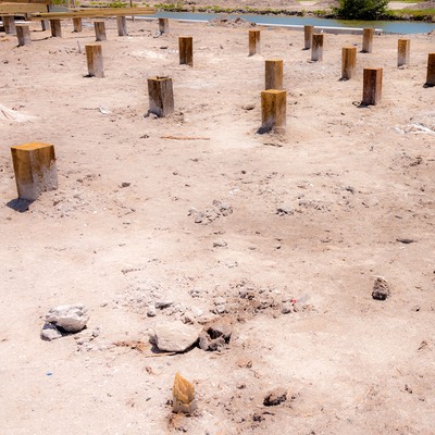 field of mahogany piers sit ready to accept cottage foundations at Mahogany Bay Village on Ambergris Caye in Belize