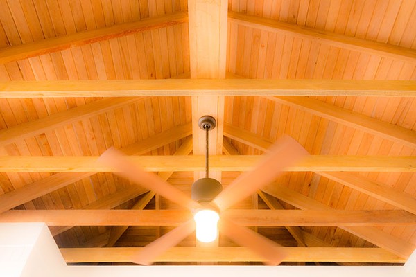 ceiling fan suspended from the mahogany roof framing of the Dream Suite at Mahogany Bay Village on Ambergris Caye in Belize keeps you cool in the heat of the day, after you've closed the louvered windows to preserve the cool of the morning