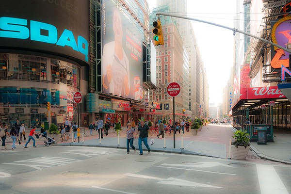 reclaimed Times Square street in all its neon splendor, with avenue stretching away beyond