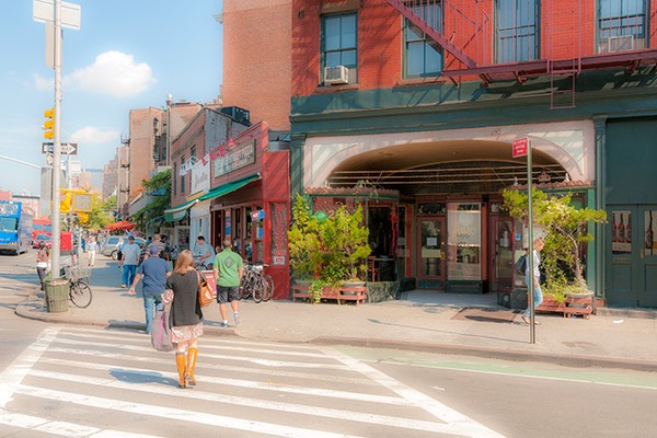 Greenwich Village street crossing bathed in the late afternoon Manhattan sun of springtime